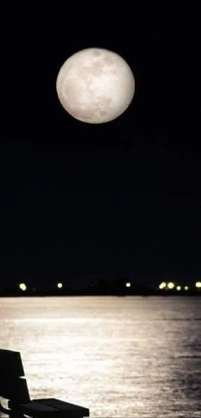 A tranquil night with a moonlit reflection by the lakeside, featuring a silhouetted bench.