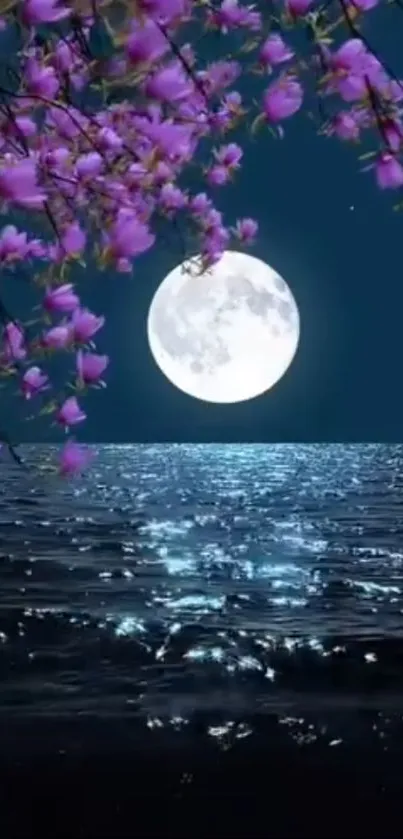Moonlit ocean with blossoms under a night sky.