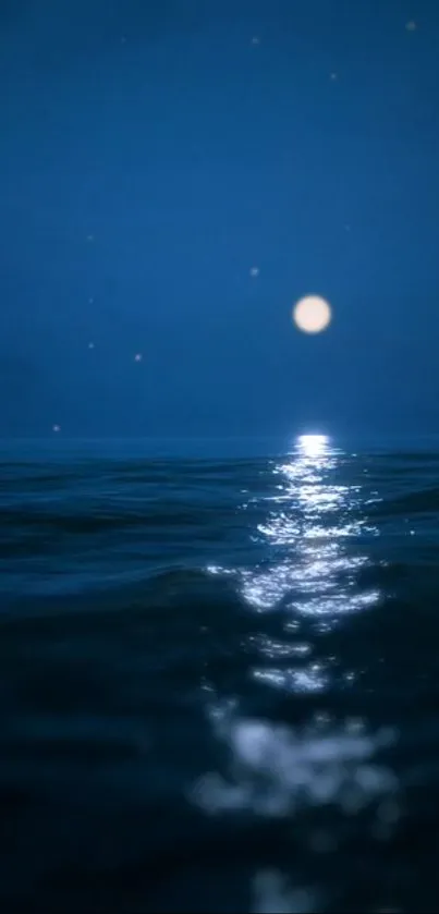 Serene moonlit ocean with a calming blue night sky and shimmering reflections.