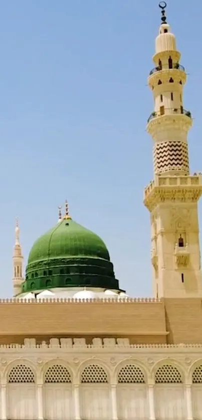 Stunning mosque with green dome under a clear blue sky, perfect for wallpapers.