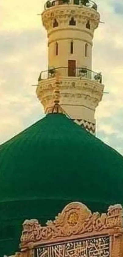 Serene green mosque dome with cloudy sky background.