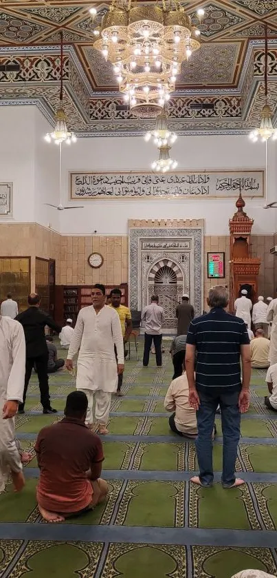 Interior view of a mosque with people gathered for prayer.