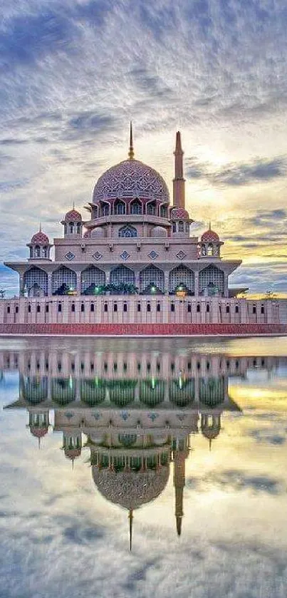 A stunning mosque reflected on tranquil water at sunset.