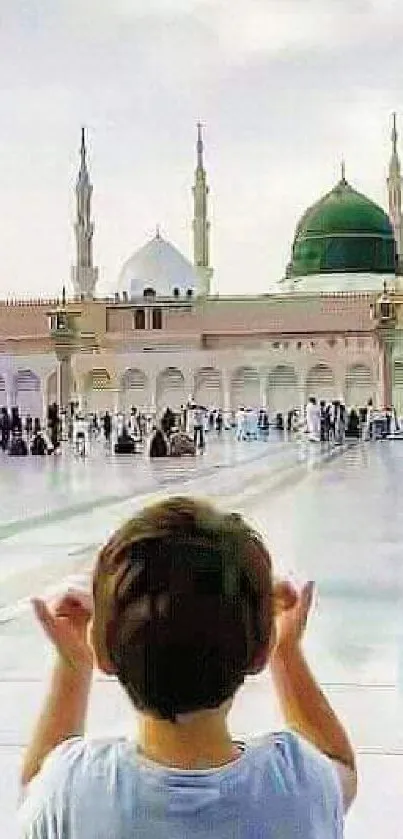 Child praying at a mosque with domes and minarets, serene atmosphere.