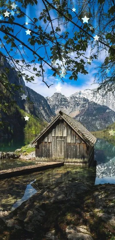 Scenic view of lake with a quaint cabin surrounded by mountains and lush greenery.