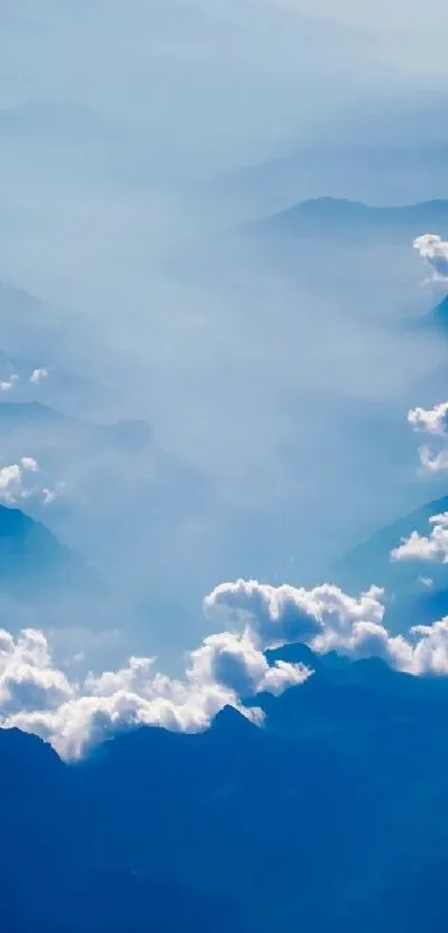 Misty mountain range with serene clouds and blue hues for a peaceful ambiance.