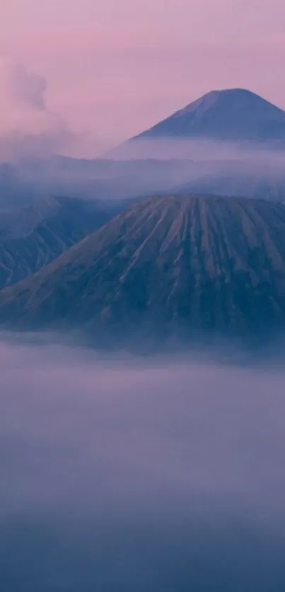 Serene wallpaper with misty purple mountains and foggy atmosphere.