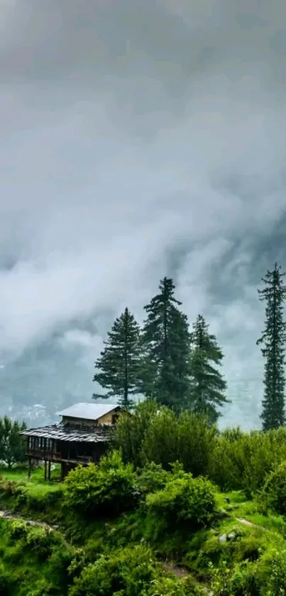 Serene mountain landscape with cabin, trees, and misty sky.