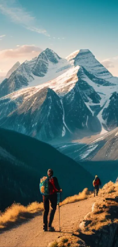 Hikers on a scenic mountain trail with majestic peaks.
