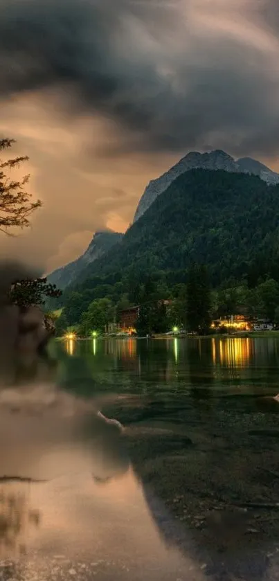 Peaceful mountain lake at sunset with a clear reflective surface and lush forests.