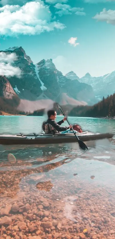 Canoeist on turquoise lake with mountain backdrop under a clear sky.