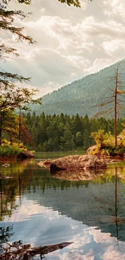 Serene mountain lake with forest reflections.