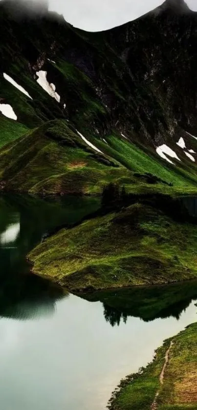 Lush green mountain landscape reflecting in a serene lake.