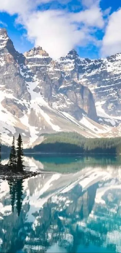 A stunning lake reflects snow-capped mountains and a clear blue sky.