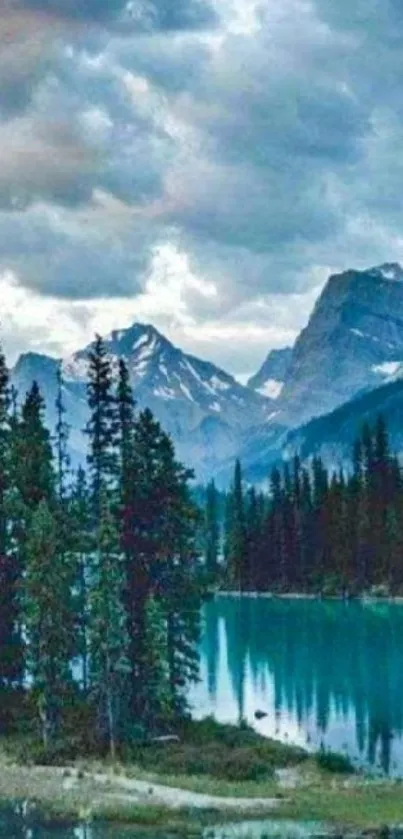 Serene mountain lake with pine trees and peaks.