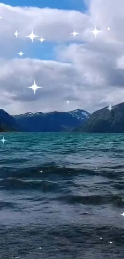 Tranquil mountain lake with sparkling reflections under a blue sky.