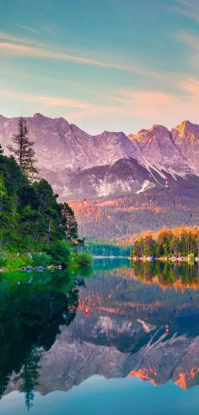 Serene mountain landscape with lake reflection at sunrise.