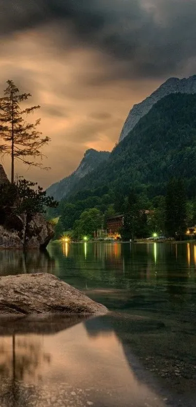 Tranquil mountain lake at sunset with forest view.