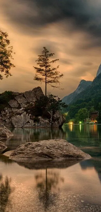 Serene mountain lake with rocky shore at dusk.