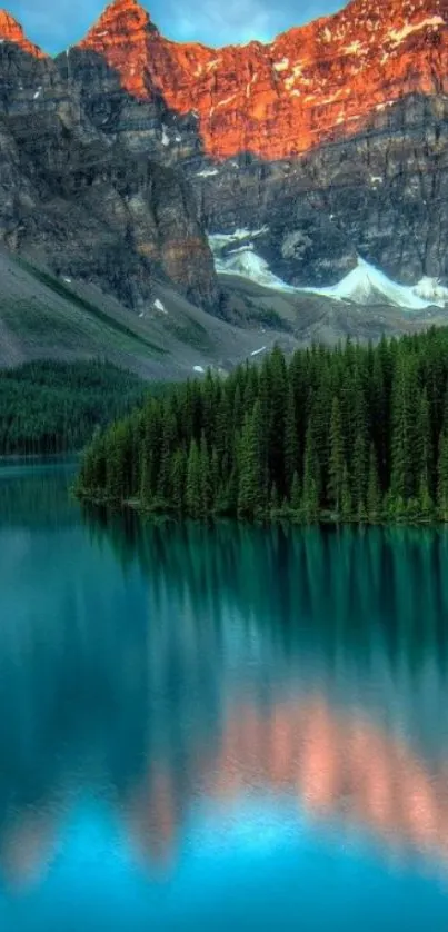 Serene mountain lake with turquoise waters and a sunset glow on the peaks.