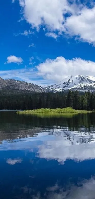 Serene mountain landscape with lake reflection and blue sky.