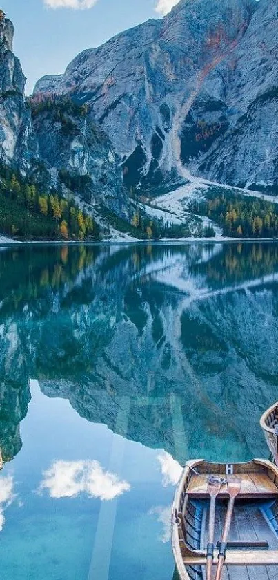 Serene mountain lake with boats and reflective waters under clear skies.