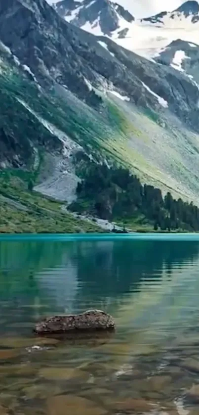 Serene mountain lake with clear water and lush greenery.