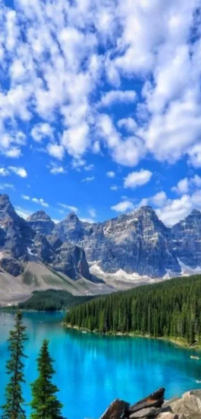 Turquoise mountain lake with blue sky and lush greenery.