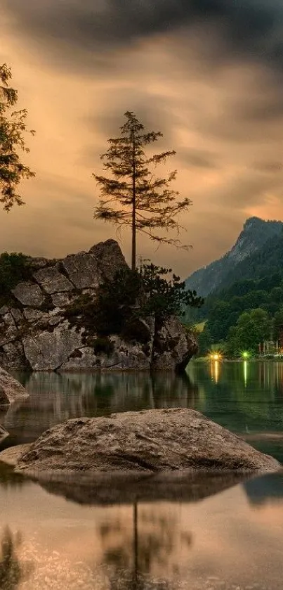 Serene lake at sunset with mountains and lush trees creating a tranquil scene.