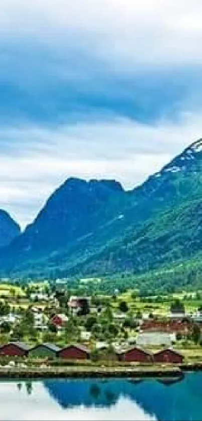 Serene lake and mountain landscape with vibrant green hills and clear sky.