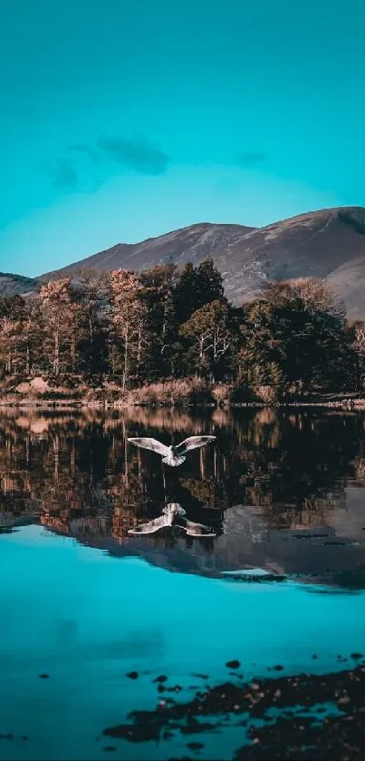 Serene lake with mountain reflection under turquoise sky.