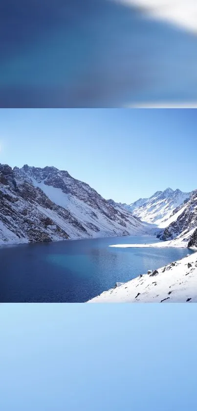 Peaceful mountain lake surrounded by snowy peaks under a bright blue sky.