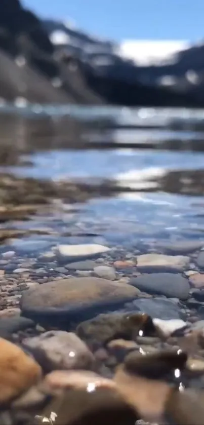 Mountain lake with clear water and pebbles.