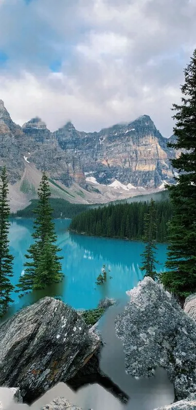 Mobile wallpaper featuring a serene mountain lake with evergreen trees and rocky landscape.