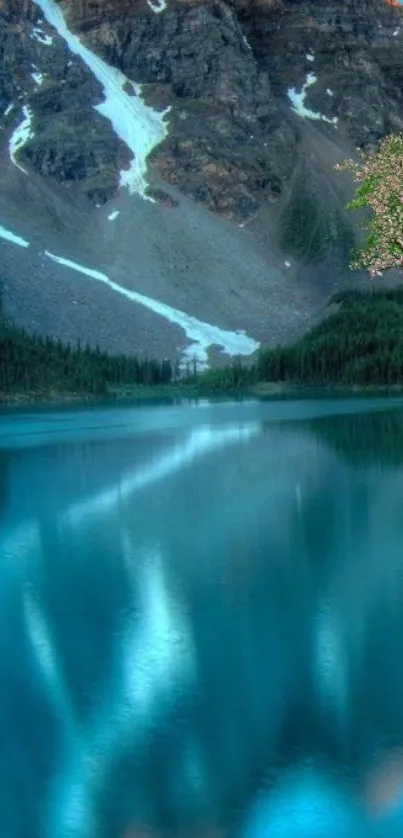 Serene mountain lake with blue waters and rocky peaks under a tranquil sky.