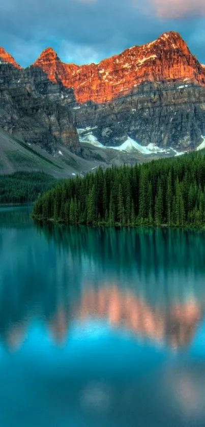 Serene mountain lake with reflections and vibrant sunset colors.