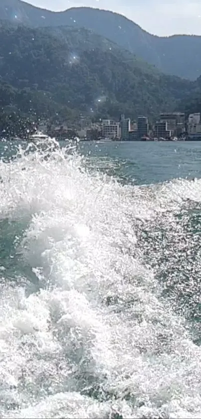 Splashing water with mountain and lake view.