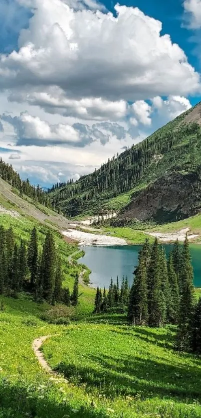 Tranquil mountain lake with lush greenery and towering trees under a cloudy sky.