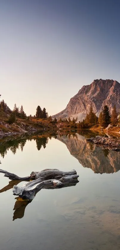 Serene mountain lake with reflection at sunset.