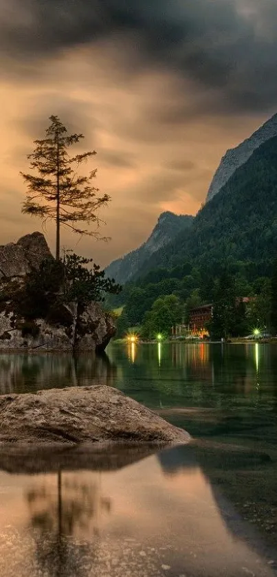 Serene mountain lake at sunset with reflections and forest backdrop.