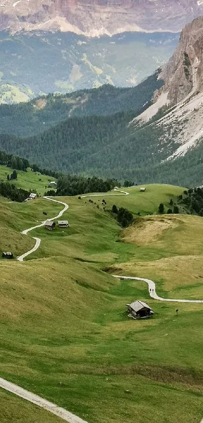 Serene mountain landscape with lush green fields and winding paths.