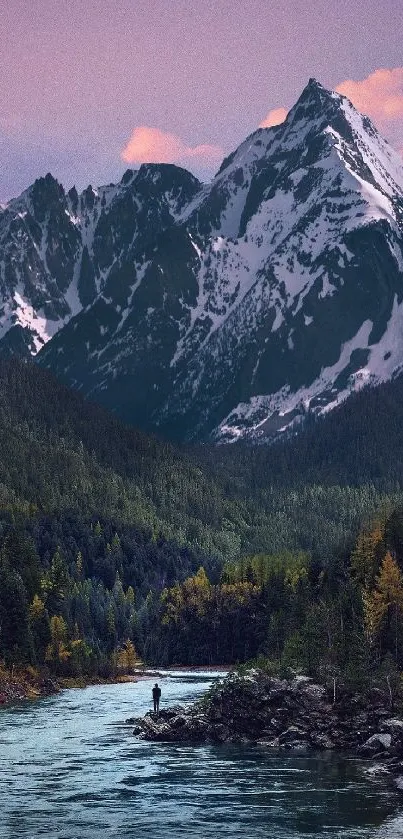 Majestic mountain landscape with a tranquil river and forest.