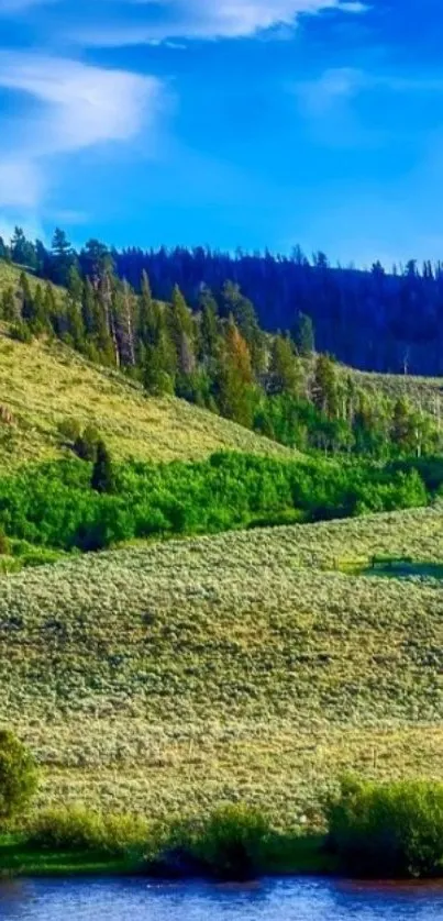 Serene green hills with river under a vibrant blue sky.