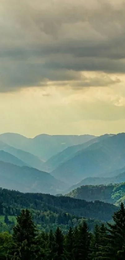 Majestic mountain landscape with green valleys and cloudy skies.