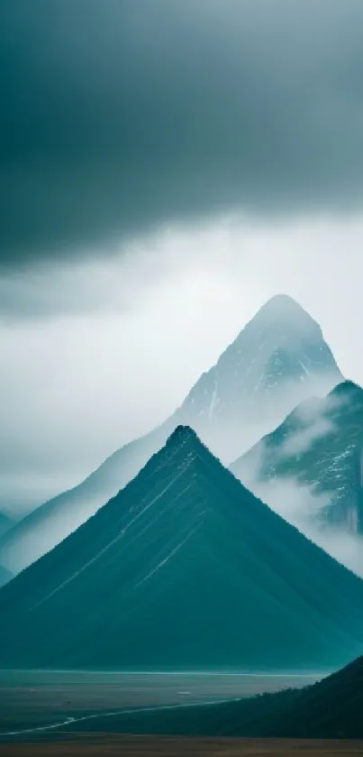 Serene mountain landscape with misty peaks and teal hues for mobile wallpaper.