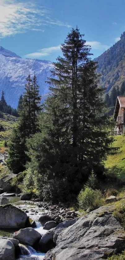 Mountain scene with lodge, trees, and a stream.