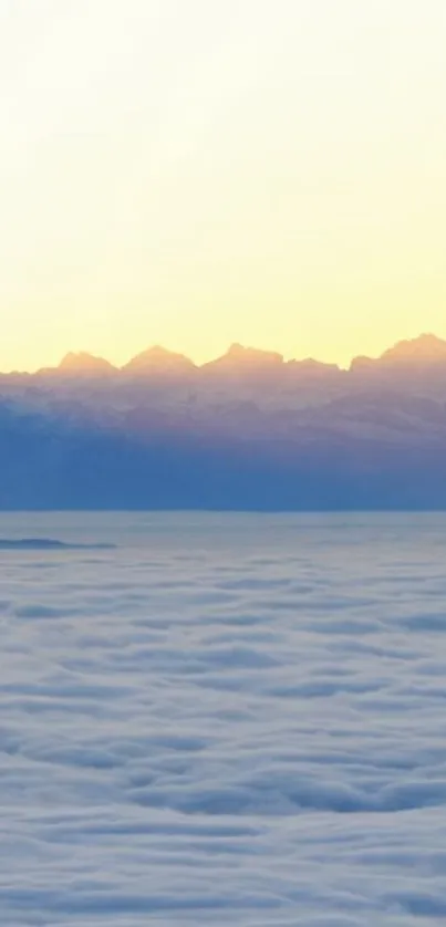 Tranquil dawn view of mountains and misty clouds.