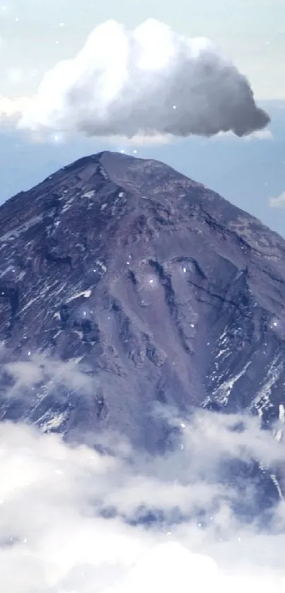 Majestic mountain peak surrounded by clouds under a blue sky.