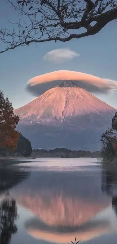 Serene mountain reflected in a tranquil lake under a dramatic blue sky at sunset.