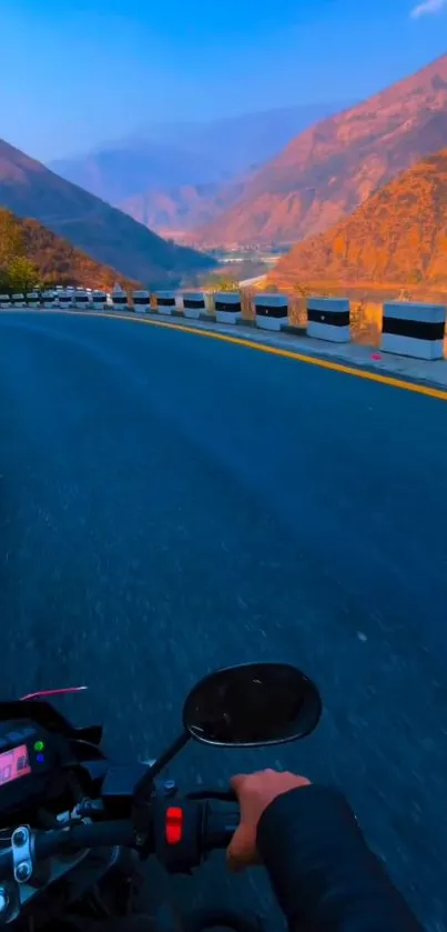 Motorcycle on a winding mountain road with stunning scenic views.